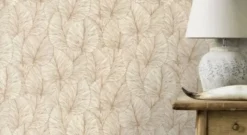 Papier peint vinyle grainé intissé feuilles de lotus beige crème et or L.1005 x l.53cm Rasch