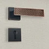 Poignée de porte design à cylindre finition aspect cuivre patiné noir Amalia - KATCHMEE