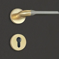Poignée de porte design à cylindre finition aspect or et gris mat Fabiana - KATCHMEE