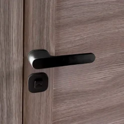 Poignées de porte sur rosace oblongue noir mat - Modèle Marina à condamnation