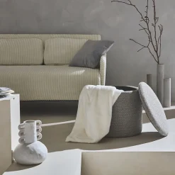 Pouf taupe en tissu avec rangement pour coussins ou plaids