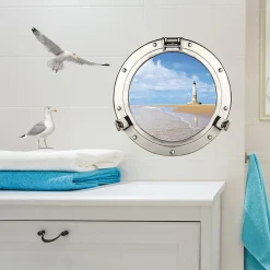 Sticker décoratif 3D Hublot trompe l'oeil, 68x48cm, vu sur le bord de mer avec phare blanc pour fenêtre.