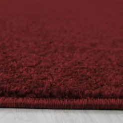Tapis salon et chambre tissé motif uni SOULA, rouge